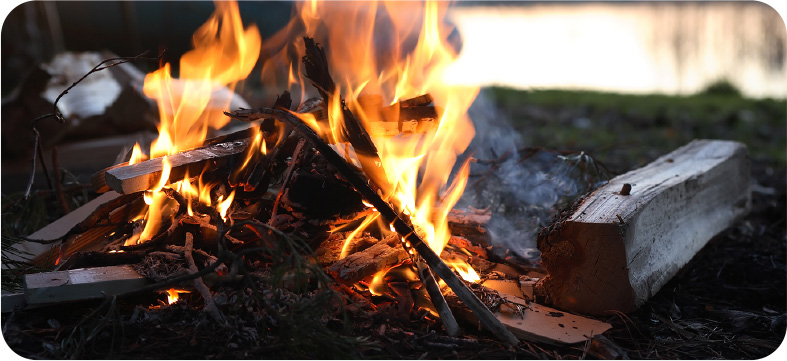 a campfire burns outside the M&M Hunting Lodge in Pennsvile, NJ